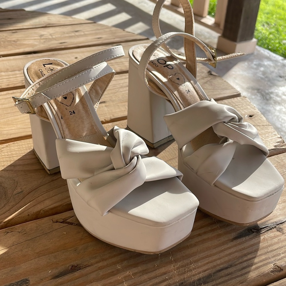 Cream colored platform heels/sandals.